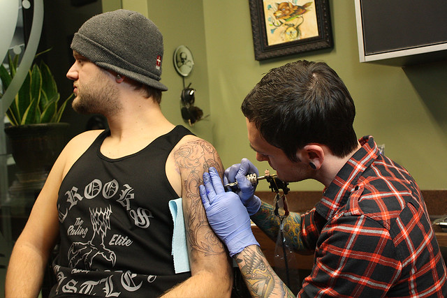 Getting tattooed by Joshua Bowers at Iron Heart Tattoo